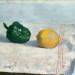 Pepper and Lemon on a White Tablecloth